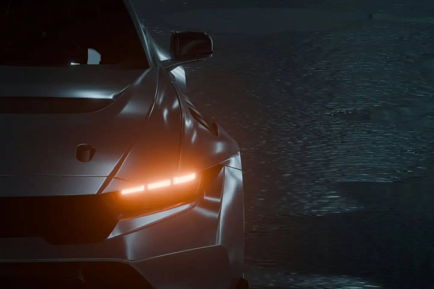 Close-up of a dark grey sports car's front wing, side mirror and amber headlight beside a rain-wet floor